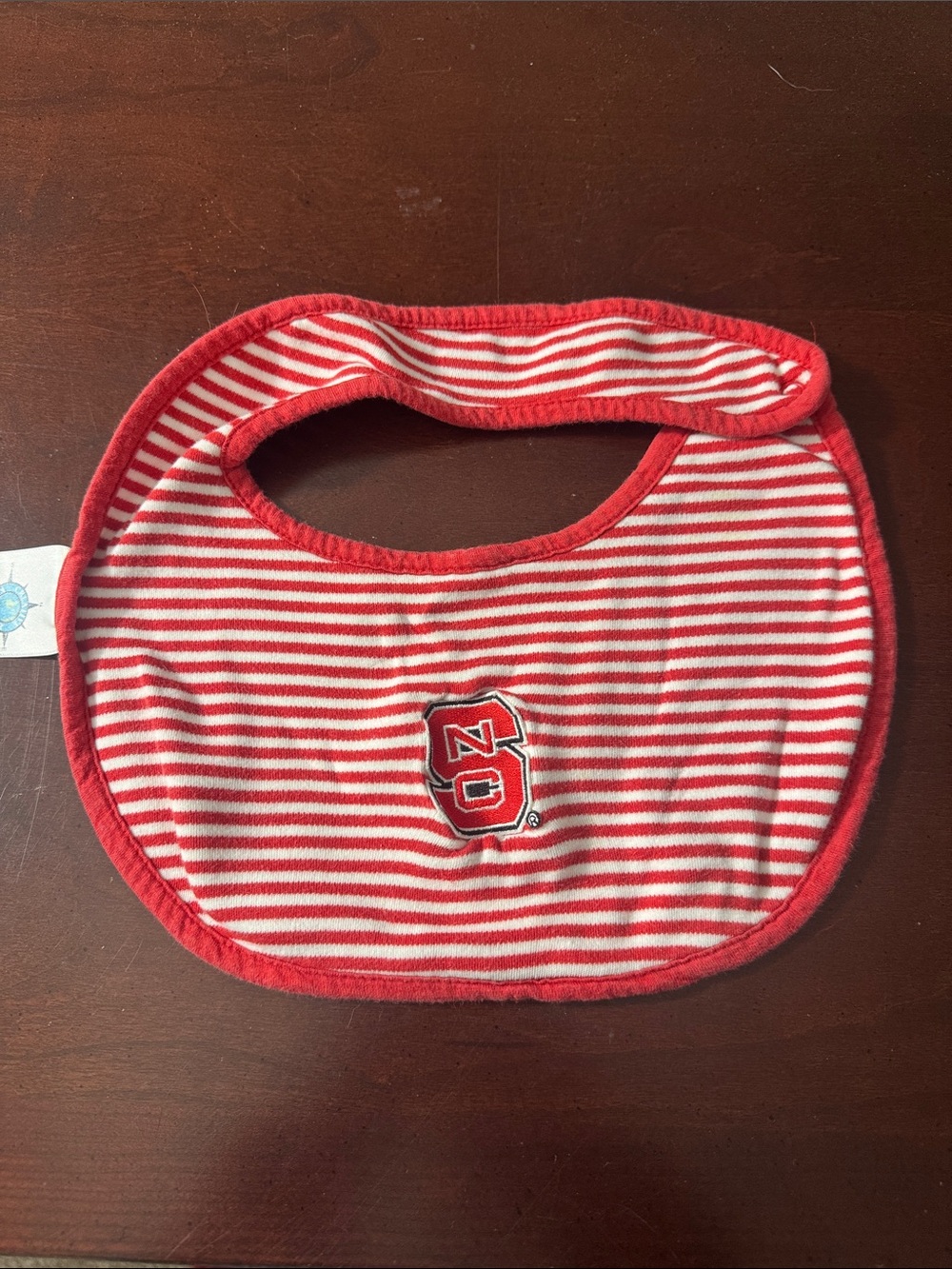 STATE Red and White Striped Baby Bib with NC Logo